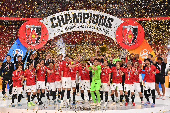 Al Ahly FC celebrate with the CAF Champions League trophy.